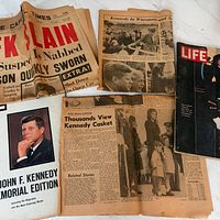 Overview of newspapers and LIFE magazine pages spread out