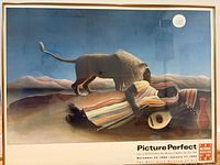 Front view of framed Henri Rousseau exhibition poster showing artwork and text
