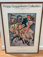 Front view of framed poster showing artwork and text