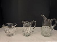 Group shot of large pitcher, creamer and sugar bowl