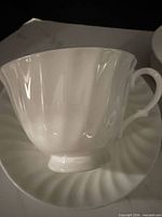 Close-up of cup on saucer showing fluted design