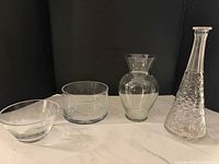 Group view of all four clear glass pieces