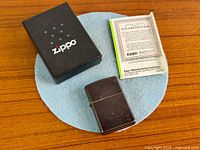 Lighter, box and guarantee leaflet together