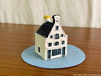 Front view of porcelain KLM house #66