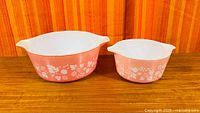 Two pink Gooseberry Cinderella casseroles side by side