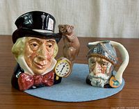 Front view of both Royal Doulton character jugs