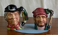 Front view of both Royal Doulton character jugs