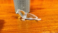 side view of Swarovski crystal sea lion figurine on tabletop