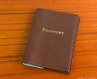 Front view showing brown leather and PASSORT embossing