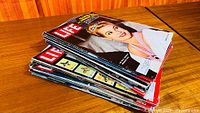 Stack of Life magazines showing celebrity cover on top
