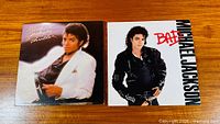 Front covers of Thriller and Bad LPs