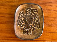 Front view of pottery dish showing Haida eagle motif