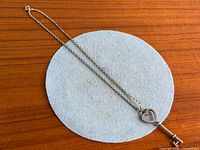 Full view of sterling chain with key pendant