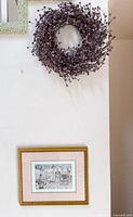 Wall view showing wreath above framed Anton Pieck print
