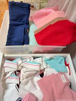 Upper bin view showing navy, mint, pink, red knit scraps and rib trim