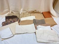 Group of assorted fabric pieces showing range of colours and patterns