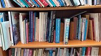 Shelf showing assorted craft and gardening books