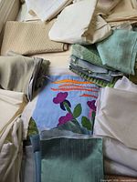 overview of assorted fabric cuts and floral applique block