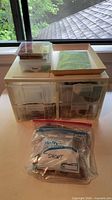 Drawer organizer with contents and zip bag of parts