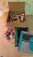 Cardboard box of large thread spools, two fabric pouches and clear bowl of small metallic spools