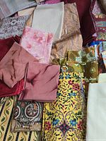 group of printed and solid cotton pieces showing patterns and colours