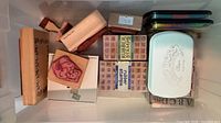 rubber stamps, ink pads, embossing tin in bin