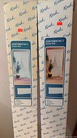 Front view of two Kirsch Continental I curtain rod boxes