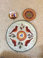 front view of placemat and two decorative plates