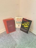 Front view of all three hardcover books standing together