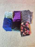 All six folded fabric remnants laid out