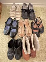 Group shot of all eight pairs laid out on carpet