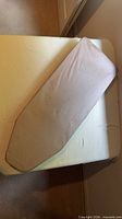 Top view of beige sleeve ironing board