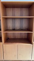 Front view showing shelves and cabinet doors