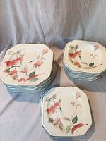 Stacks of dinner plates, salad plates and bowls showing pattern