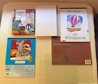 Overview of five paper pads on table