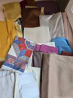 Overview of assorted fabric scraps in multiple colors and textures