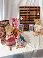 overview of dolls, ornaments, shelf and decorative box