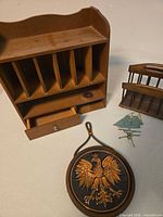 Overall view showing mail cubby, eagle plaque, letter holder, sailboat ornament