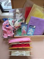 Lot overview showing ribbons on cards, tulle sheets, appliques and trim