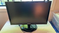 Front view of Samsung 21-inch monitor on stand showing screen and bezel