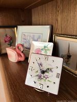 Overall lot showing clock, planter, framed prints, dish