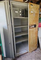 Full view of open Chubb safe showing shelves and inner lock box