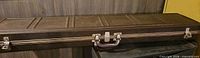 Full view of brown hard-shell case closed