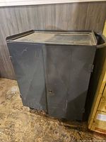 Front view of gray steel rolling cabinet with casters