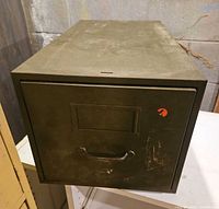 Front view of olive green single-drawer file cabinet