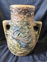 Front view of Roseville Imperial I vase showing textured glaze and vine motif