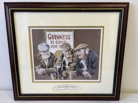 Front view of framed Guinness advertising print