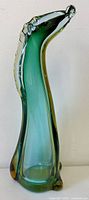 Front view of tall green and amber sommerso glass horse