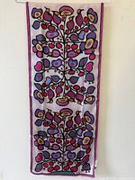 Scarf hanging full length showing design