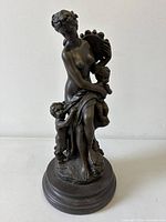 Full view of bronze sculpture on marble base